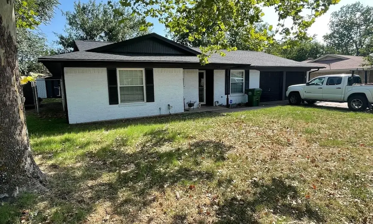 Professional roofing crew working on a residential roof in Brigantine